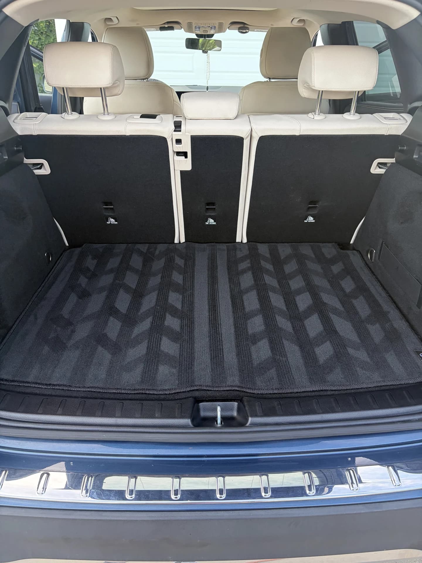 Clean SUV cargo area with neatly arranged floor mats