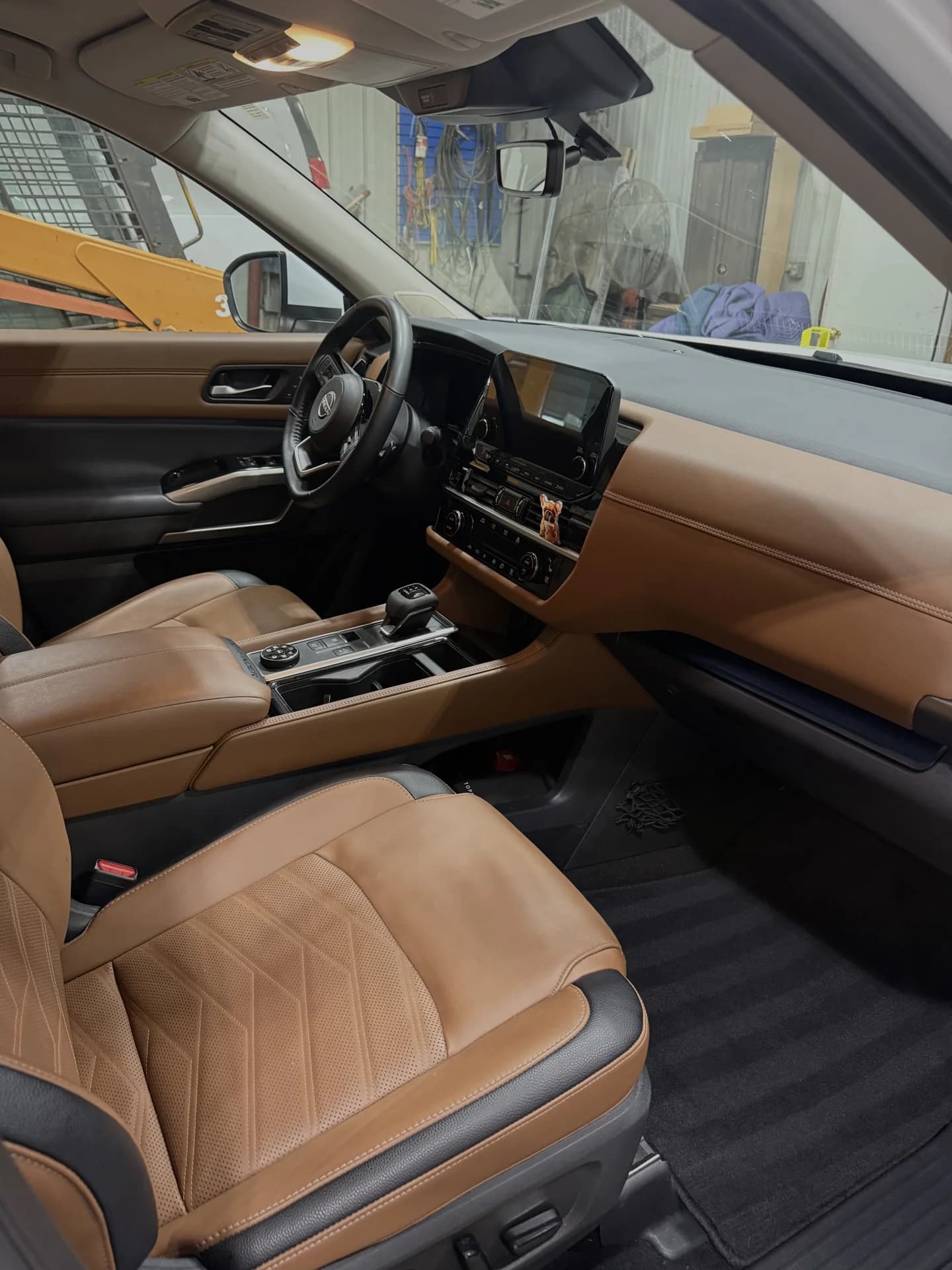 Clean tan leather seats and cabin of a pickup truck